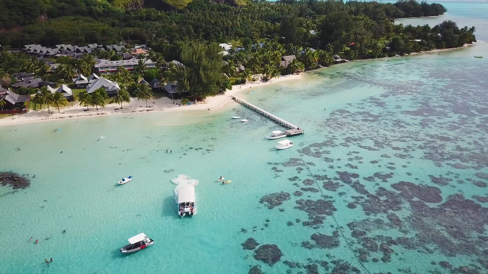 Bungalows by the lagoon, on Moorea's north-west coast